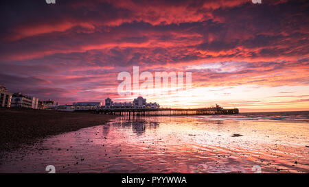 A Bright red Sunrise at south Parade Pier, Southsea, Portsmouth, Hampshire Stock Photo