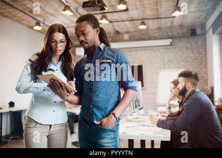 Picture of perspective designers using tablet in office Stock Photo