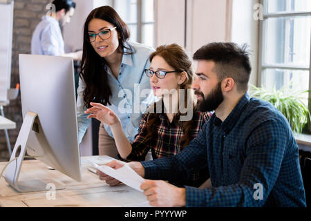 Young architects working on project in office Stock Photo