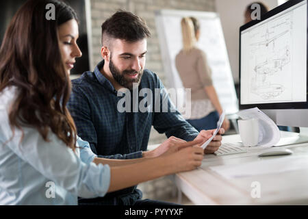 Young architects working on project in office Stock Photo