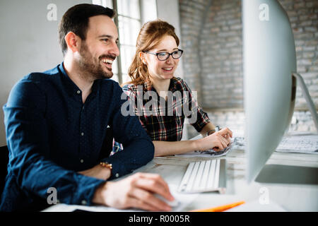 Young architects working on project in office Stock Photo