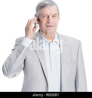 confident senior businessman with mobile phone. isolated on a white background Stock Photo