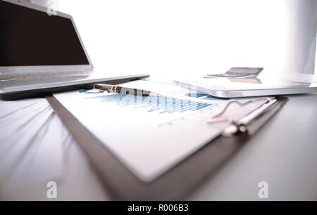business background. financial charts on the desktop Stock Photo