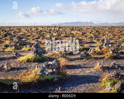 Laufskalavarda -- a lava ridge, surrounded by stone cairns in South Iceland Stock Photo