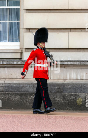 LONDON - JUL 1, 2015: Queens Guard in front of the Buckingham Palace in London district. Stock Photo