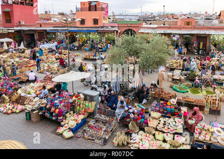 MARRAKESH, MOROCCO - APR 28, 2016: Local people selleing their goods at the berber market in the souks of Marrakech. Stock Photo