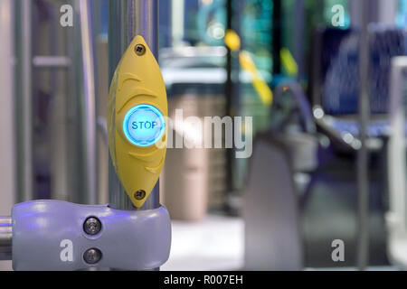 Illuminated bus stop button in a modern bus Stock Photo