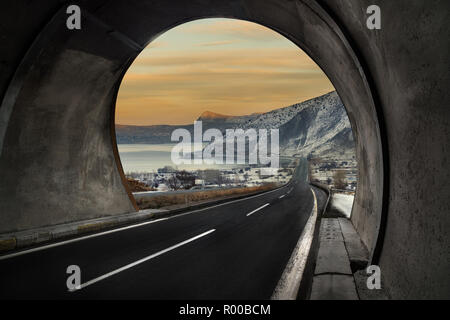 Tunel and asphalt road, background lake view Stock Photo