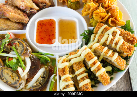 Thai-style Hors d'oeuvres on white dish, appetizer Stock Photo