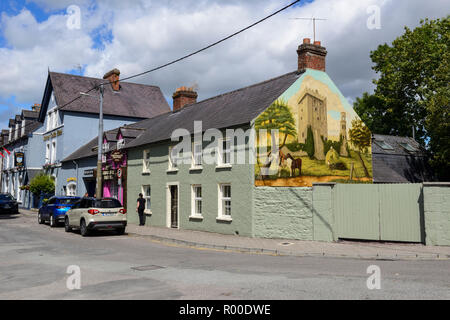 Mural on side of building depicting Blarney Castle in The Square, Blarney Village, near Cork in County Cork, Republic of Ireland Stock Photo