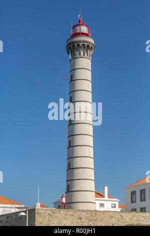 View of lighthouse, typical Portuguese architecture, with details and very particular framing, blue sky as background, located in Leça da Palmeira, Op Stock Photo