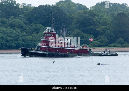 PERTH AMBOY, NEW JERSEY - August 7, 2017: The Brendan Turecamo Tugboat travels the Arthur Kill between New Jersey and Staten Island.