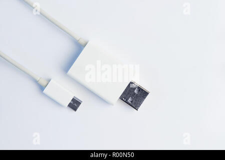 White micro USB cables on white background. Connectors and sockets for PC and mobile devices. Computer peripherals connector or recharge supply. Stock Photo