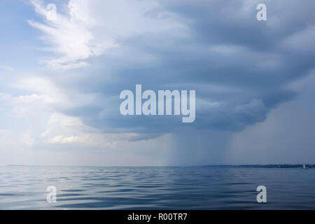 Rain zone on the coastal area of the sea Stock Photo
