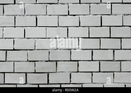 Fragment of a brick wall painted with white Stock Photo