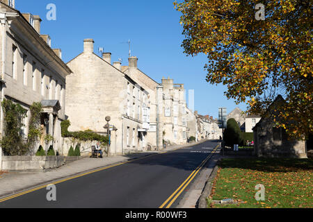 View of Cotswold stone houses along New Street in autumn afternoon sunshine, Painswick, Cotswolds, Gloucestershire, England, United Kingdom, Europe Stock Photo