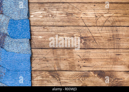 Warm wool knitted socks for cold winter on wooden background Copy space Stock Photo