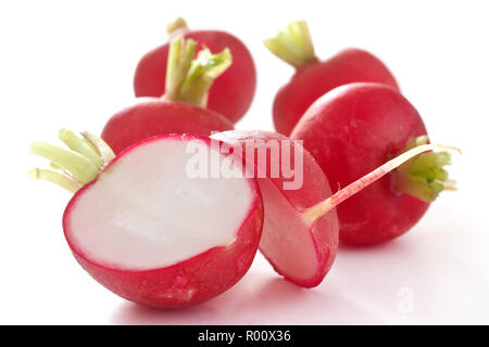Red radish cut in half on white Stock Photo