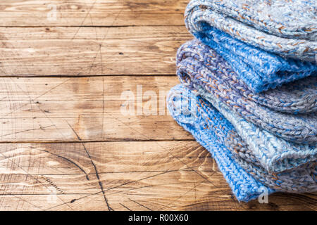 Warm wool knitted socks for cold winter on wooden background Copy space Stock Photo