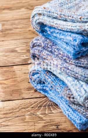Warm wool knitted socks for cold winter on wooden background Copy space Stock Photo