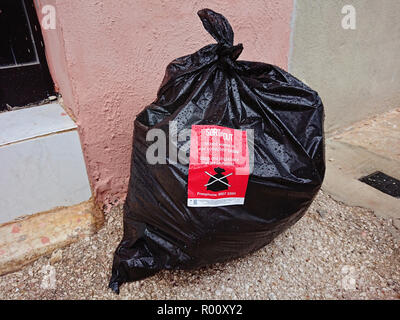 Valletta Malta October 31 2018 Black waste bag on street with