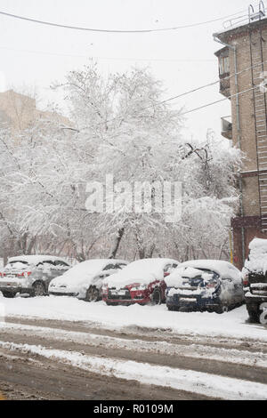 cars parked near the house, covered with snow on a winter day, top view  Stock Photo - Alamy
