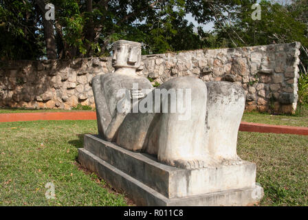 A modern Chacmool, a specific form of Mesoamerican sculpture of a reclining man, possibly symbolizing slain warriors, along the road to Chichen Itza. Stock Photo