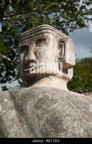 A modern Chacmool, a specific form of Mesoamerican sculpture of a reclining man, possibly symbolizing slain warriors, along the road to Chichen Itza. Stock Photo