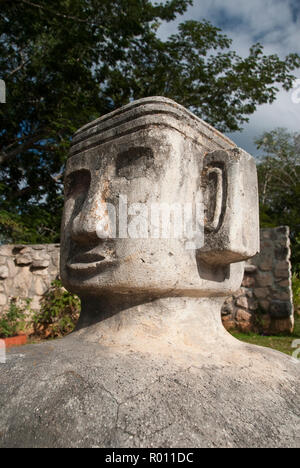 A modern Chacmool, a specific form of Mesoamerican sculpture of a reclining man, possibly symbolizing slain warriors, along the road to Chichen Itza. Stock Photo