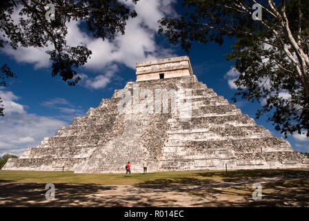 Tourists visit El Castillo, also known as the Temple of Kukulcan, a Mesoamerican step-pyramid at the Chichen Itza archaeological site in Mexico. Stock Photo