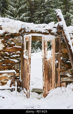 Old abandoned demolished house covered with snow in winter Stock Photo ...