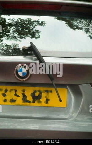 After driving through the Monkey Jungle enclosure at Longleat Safari Park, this car has damage to its rear windscreen wiper.  Longleat, England. UK. (103) Stock Photo