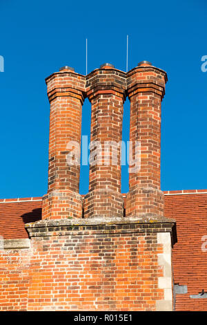 Restored red chimney stacks / pot / pots on the Tudor building roof in England. uk (103) Stock Photo