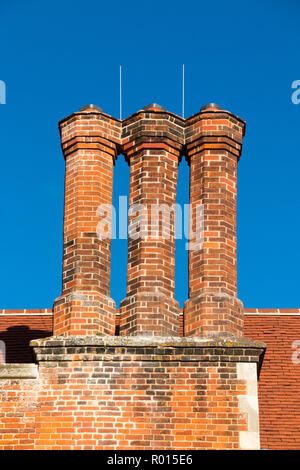 Restored chimney stacks on the roof of a 500 year old Tudor mansion ...