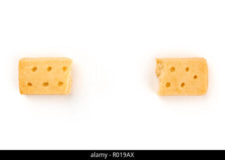 An overhead photo of two pieces of a Scottish shortbread butter cookie, shot from the top on a white background with copy space Stock Photo
