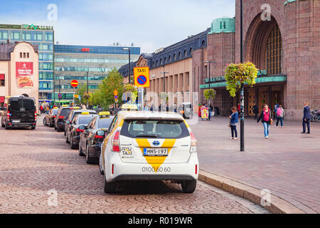 20 September 2018: Helsinki, Finland - Taxi cabs lined up at the railway station. Stock Photo