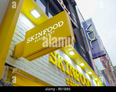 October 2018 - Seoul, South Korea: Yellow logo and storefront of the South Korean skine care and cosmetics brand Skinfood Stock Photo