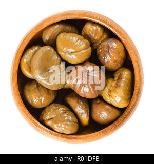 Cooked sweet chestnuts in wooden bowl. Edible seeds or nuts of Castanea sativa, also called marron and Spanish or Portuguese chestnut.