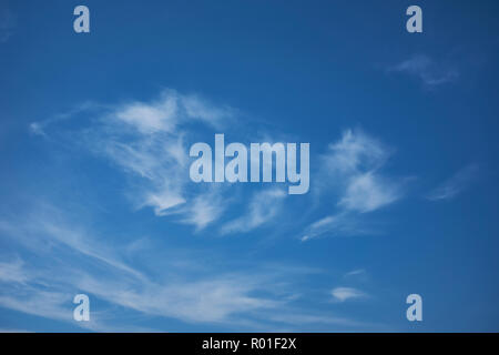 Blue sky with a small amount of thin white clouds Stock Photo
