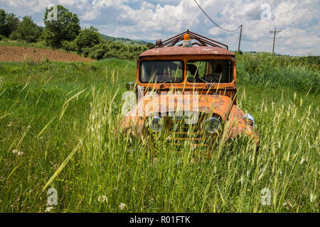 GREECE, KASTORIA. Abandoned wreck of a pick up truck in a field near Kastoria Stock Photo