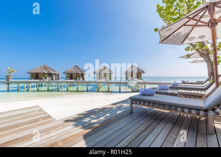 Luxury water villas in Maldives, tropical resort or hotel background. Exotic travel destination and Stock Photo