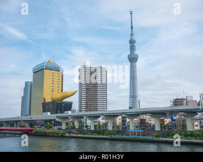 Tokyo, Japan - September 12, 2018: View of the Tokyo skyline from across the river in Asakusa including the Tokyo Skytree and the Asahi Beer Hall Stock Photo