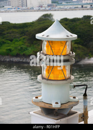 Aircraft and boat orange warning light on a big bridge Stock Photo
