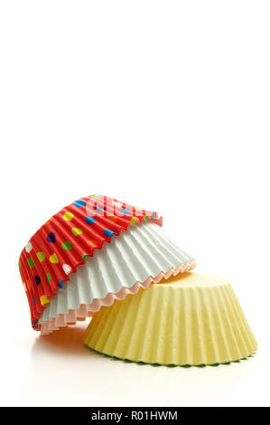 Stacked Multi-Colored Muffin Baking Cups on White Background Stock Photo