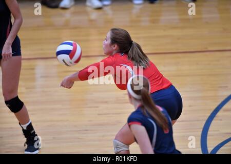 Player accepting and returning an opposing serve at mid-court. USA Stock Photo