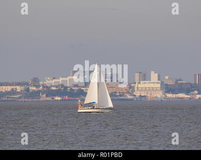 Sheerness, Kent, UK. 31st Oct, 2018. UK Weather: a bright and sunny afternoon in Sheerness, Kent.  A yacht sails past Southend on sea. Credit: James Bell/Alamy Live News Stock Photo