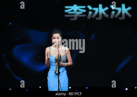 (181031) -- LOS ANGELES, Oct. 31, 2018 (Xinhua) -- Actress Li Bingbing who won the Best Actress Award, receives the trophy during the awarding ceremony of the 14th Chinese American Film Festival (CAFF) in Los Angeles, the United States, Oct. 30, 2018. The 14th Chinese American Film Festival (CAFF) kicked off Tuesday at the Ricardo Montalban Theater in Hollywood in the U.S. city of Los Angeles. (Xinhua/Li Ying)(rh) Stock Photo