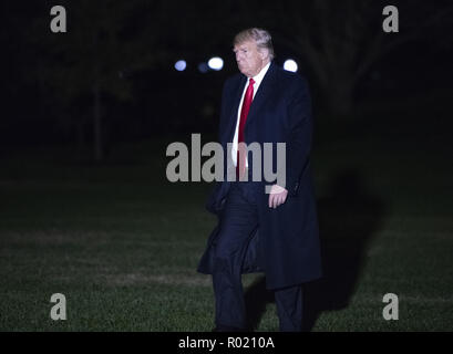 Washington, District of Columbia, USA. 31st Oct, 2018. United States President Donald J. Trump walks on the South Lawn of the White House in Washington, DC after delivering remarks at a Make America Great Again Rally in Estero, Florida on Wednesday, October 31, 2018 Credit: Ron Sachs/CNP/ZUMA Wire/Alamy Live News Stock Photo