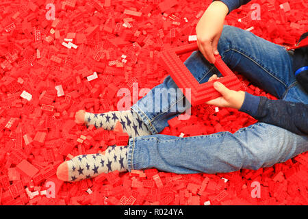 Little boy playing with lego Stock Photo