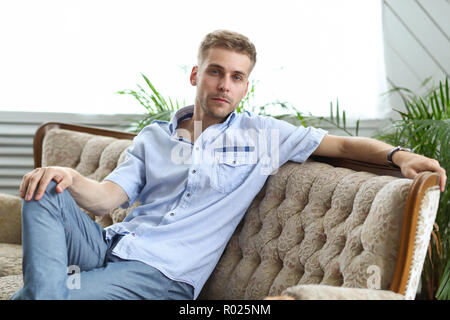 Handsome man in a blue shirt Stock Photo